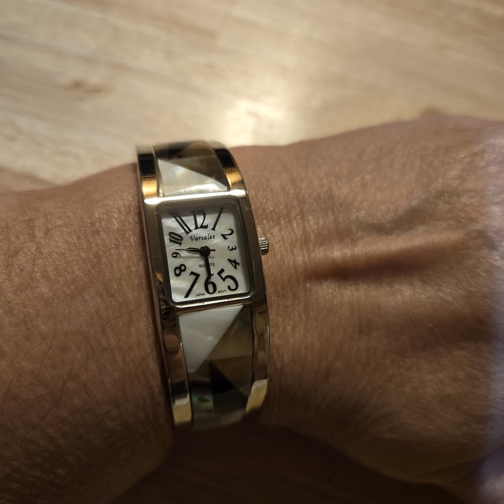 Beautiful women's bangle watch with abalone, onyx and mother of pearl